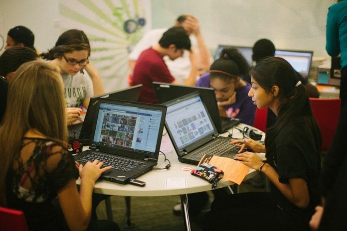 Photo of students at computer lab kiosk